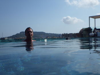 Portrait of woman swimming in pool