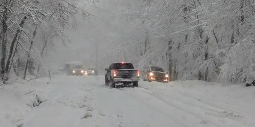 Car on snow covered road in winter