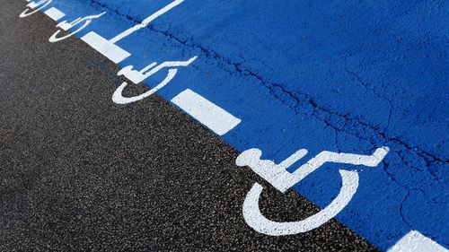 Full frame shot of road with disabled signs