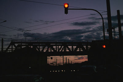 Low angle view of illuminated street light against sky