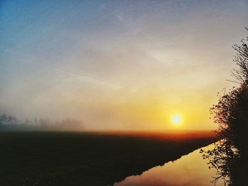 Scenic view of sunset over river