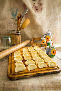Close-up of dumplings on wooden serving board