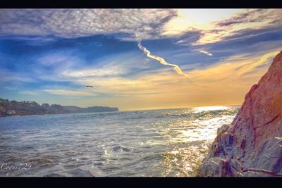 Scenic view of sea against sky at sunset