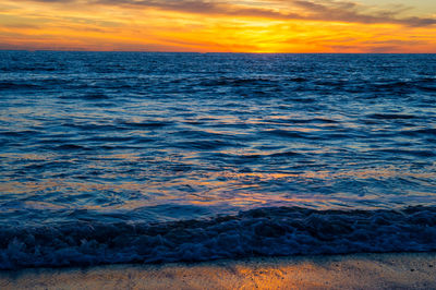 Scenic view of sea against dramatic sky