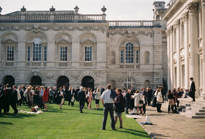 Group of people in front of historical building