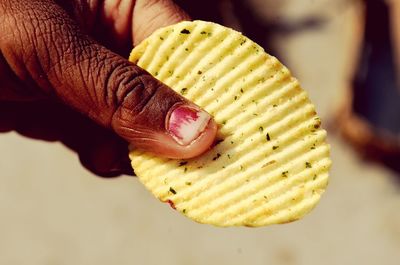 Close-up of hand holding burger