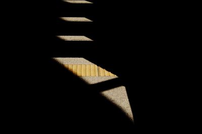 Shadow of sunlight on tiled floor