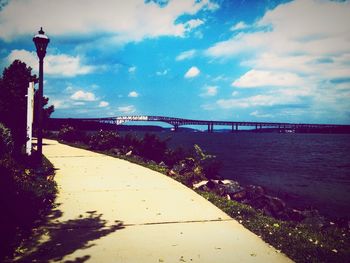 View of bridge against cloudy sky