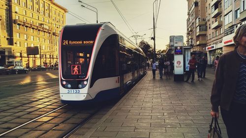 View of train on street in city