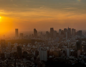 Cityscape against sky during sunset