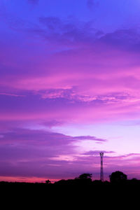 Silhouette of pink tower against sky during sunset