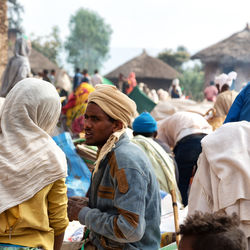 Rear view of people standing at music festival