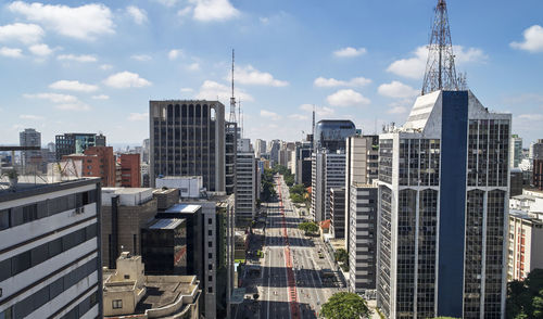 Modern buildings in city against sky