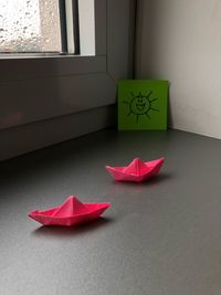 Close-up of paper boats on table at home
