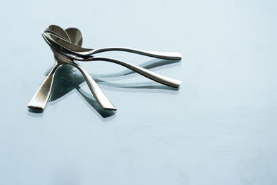Close-up of shoes on table against white background