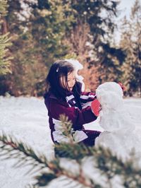 Girl building a snowman