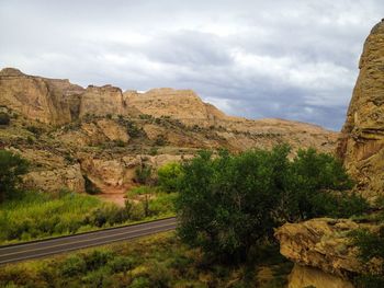 Scenic view of mountains against cloudy sky