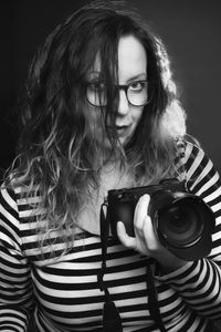 Portrait of young woman wearing hat