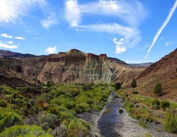 Panoramic view of road amidst mountains against sky