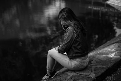 Young woman sitting outdoors