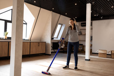 Full length of woman standing on floor