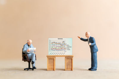 Man and woman standing on table