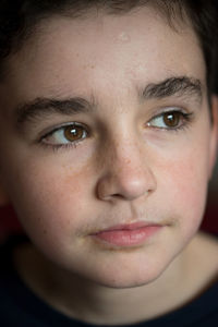 Close-up of boy looking away