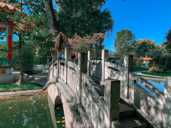 View of footbridge against plants