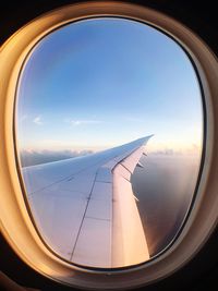 View of airplane wing seen through window