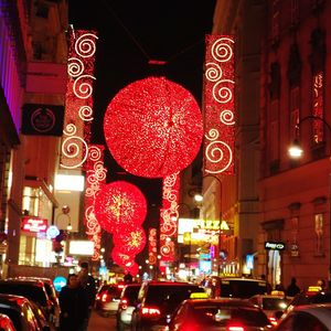 Illuminated city street at night