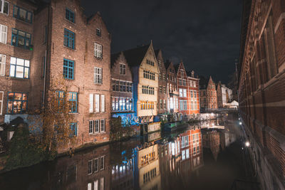 Low angle view of buildings in city at night