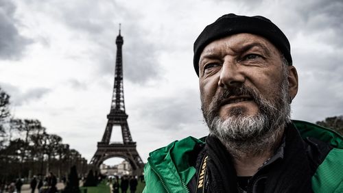 Portrait of man against cloudy sky