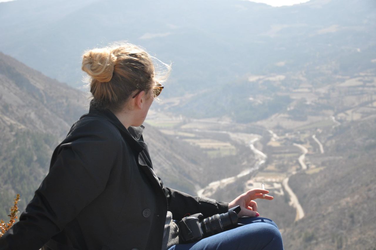 mature adult, one person, adults only, sitting, contemplation, warm clothing, mountain range, mountain, day, people, mature women, winter, only women, landscape, adult, portrait, one woman only, curly hair, adventure, beauty in nature, outdoors, sky