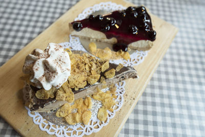 High angle view of dessert on serving board at table