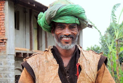 Portrait of smiling old indian man outdoors