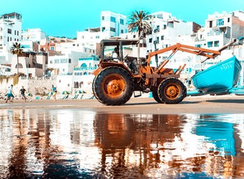 Reflection of building on water in city