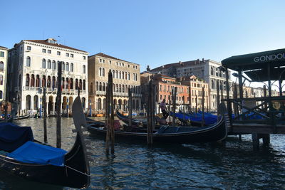 Gondolas docked in front of beautiful buildings in venice