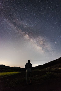 Full length of man standing against star field