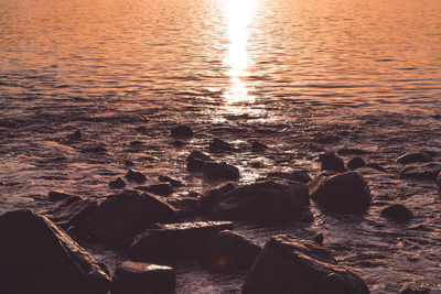 Aerial view of sea during sunset