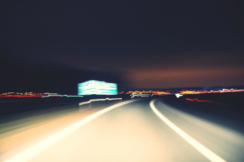 ROAD PASSING THROUGH ILLUMINATED TUNNEL