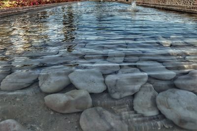 High angle view of stones in lake