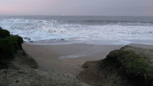 Scenic view of beach against clear sky