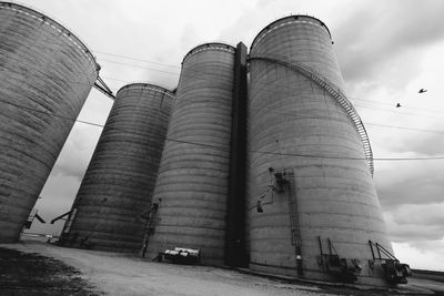 Low angle view of factory against sky