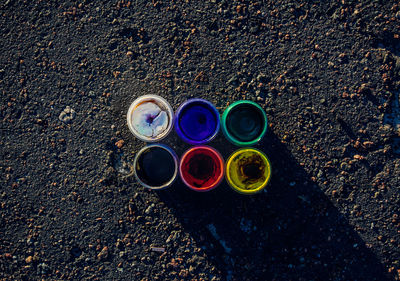 Directly above shot of color bottles on road