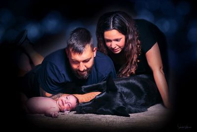 Father and daughter with baby at home