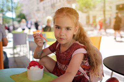Portrait of girl holding ice cream
