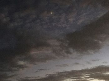 Low angle view of moon in sky at night