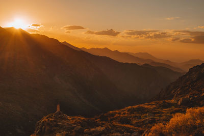 Scenic view of mountains against sky during sunset