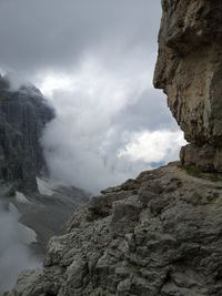 Low angle view of rock formations against sky