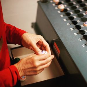 Cropped image of woman holding bingo ball